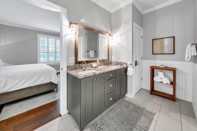 bathroom featuring vanity, crown molding, and tile floors