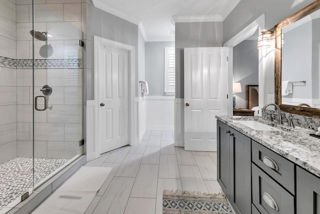 bathroom featuring ornamental molding, an enclosed shower, tile flooring, and vanity