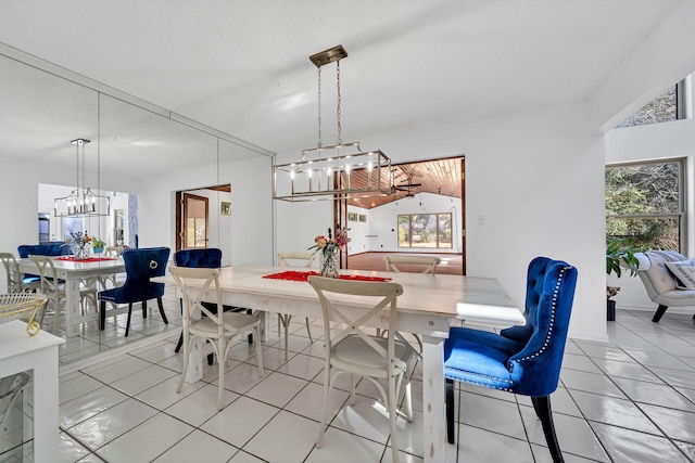 dining area with a notable chandelier and light tile floors