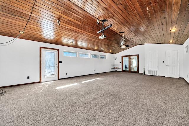 carpeted empty room featuring wood ceiling, lofted ceiling, french doors, and ceiling fan