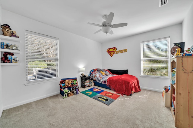 carpeted bedroom featuring ceiling fan