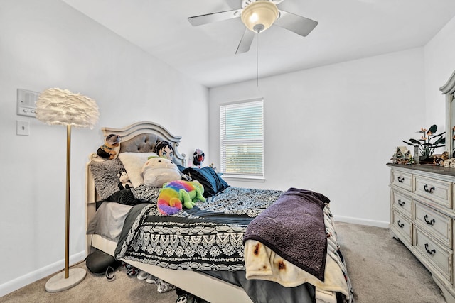 bedroom featuring ceiling fan and light carpet