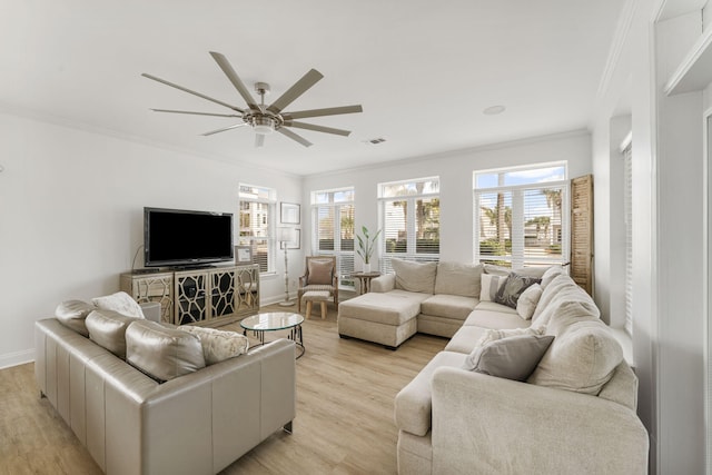 living room featuring light hardwood / wood-style flooring, crown molding, and ceiling fan