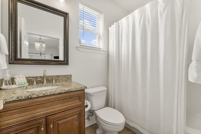 bathroom with toilet and vanity