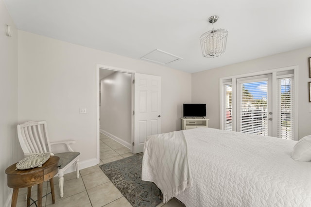 tiled bedroom featuring access to exterior