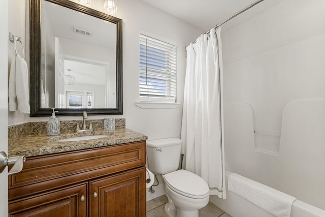 full bathroom featuring tile flooring, vanity with extensive cabinet space, shower / bath combo, and toilet