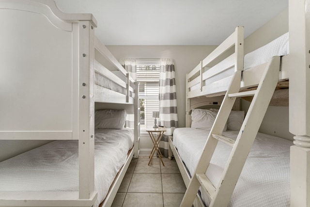 unfurnished bedroom featuring light tile flooring