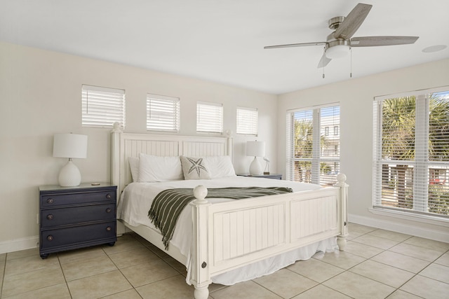 bedroom featuring ceiling fan and light tile floors