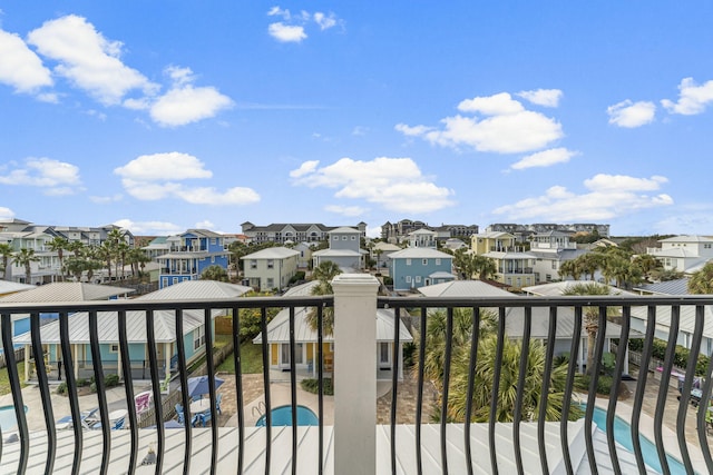 balcony featuring a community pool