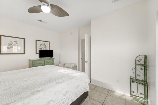 tiled bedroom with ceiling fan