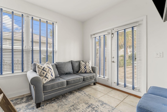 tiled living room with a healthy amount of sunlight