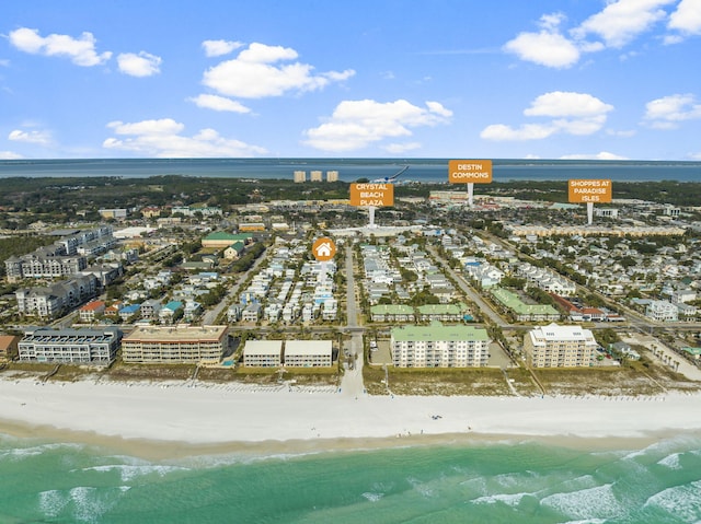 birds eye view of property with a view of the beach and a water view