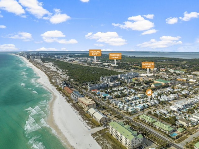 birds eye view of property featuring a view of the beach and a water view