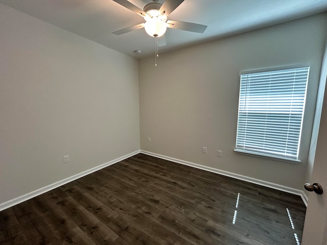 unfurnished room featuring dark hardwood / wood-style flooring and ceiling fan