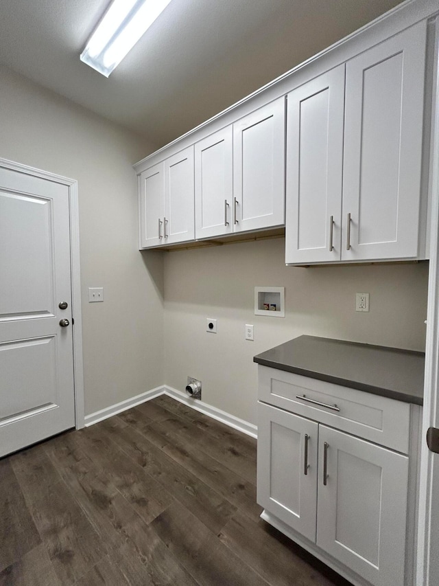 clothes washing area with cabinets, hookup for an electric dryer, dark hardwood / wood-style floors, and washer hookup