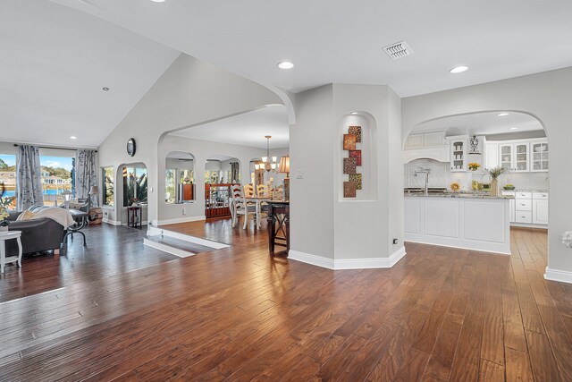 interior space with sink, dark hardwood / wood-style floors, and a chandelier