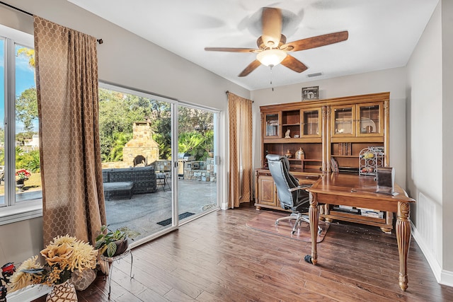 office with ceiling fan and hardwood / wood-style floors