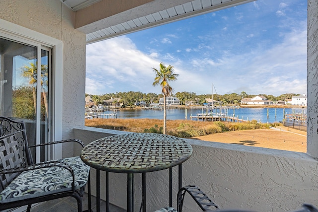 balcony featuring a water view