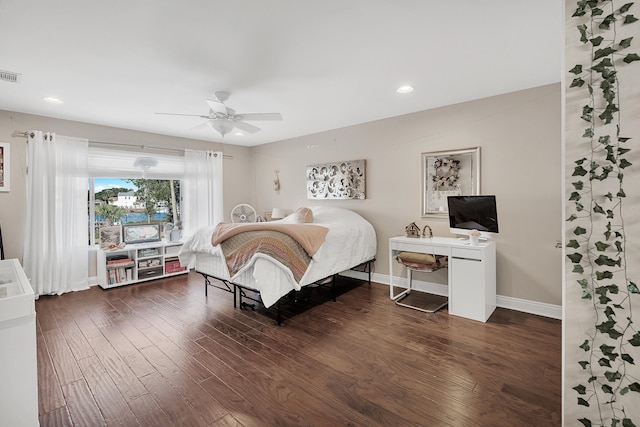 bedroom with dark wood-type flooring and ceiling fan