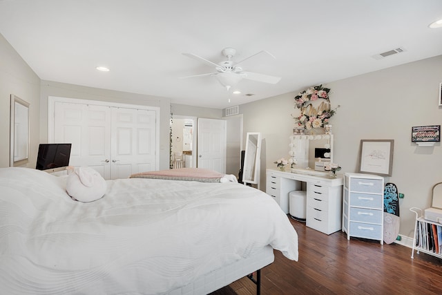 bedroom with ceiling fan, dark hardwood / wood-style flooring, and a closet