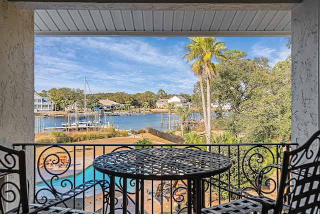 balcony featuring a water view