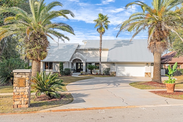 view of front of property with a garage