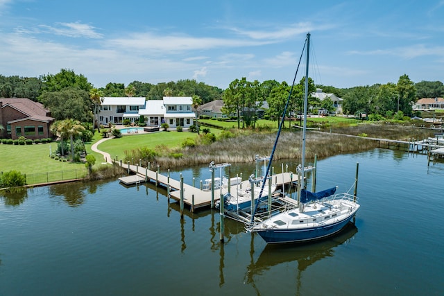 view of dock featuring a yard and a water view