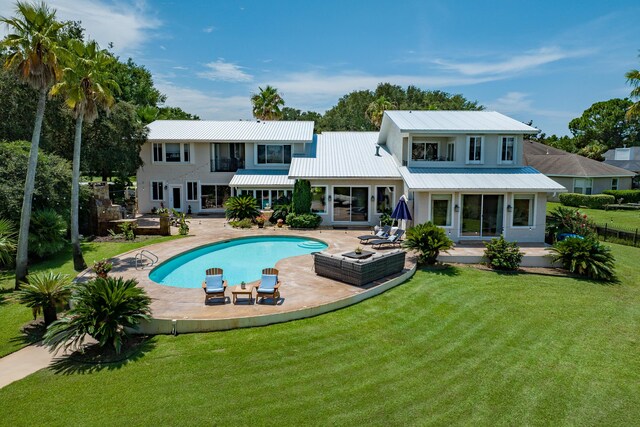 view of pool featuring a patio and a lawn