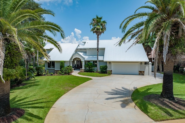 view of front facade featuring a garage and a front lawn