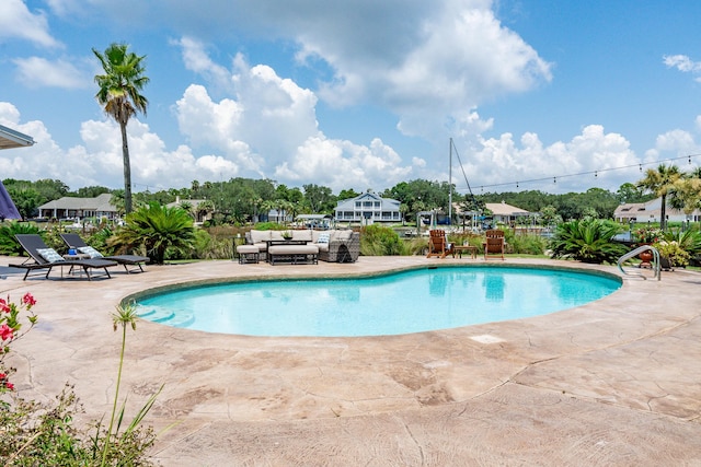 view of swimming pool featuring a patio area