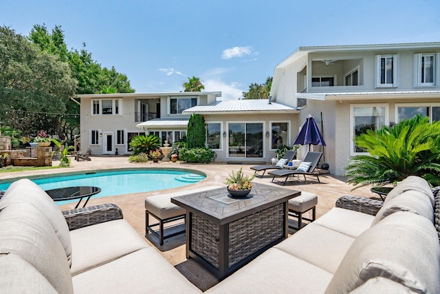 view of swimming pool with an outdoor hangout area and a patio area