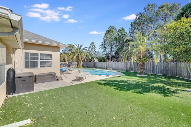 view of yard featuring a fenced in pool and a patio area