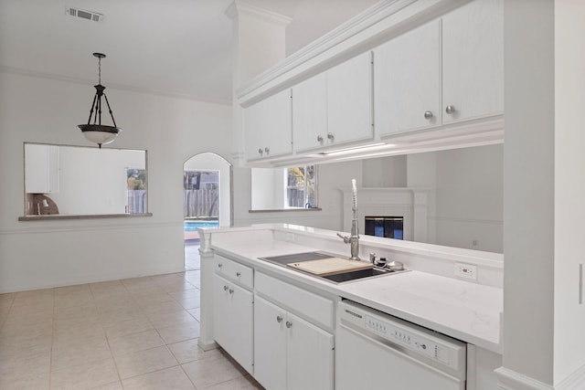 kitchen featuring decorative light fixtures, white cabinetry, dishwasher, sink, and light tile patterned floors