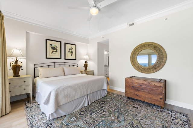 bedroom with ceiling fan, crown molding, and light hardwood / wood-style floors