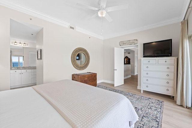 bedroom with ornamental molding, ensuite bath, light hardwood / wood-style floors, and ceiling fan