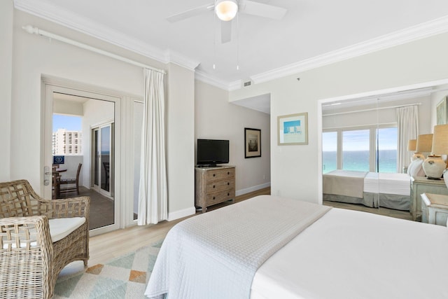 bedroom with a water view, ceiling fan, light hardwood / wood-style floors, and ornamental molding