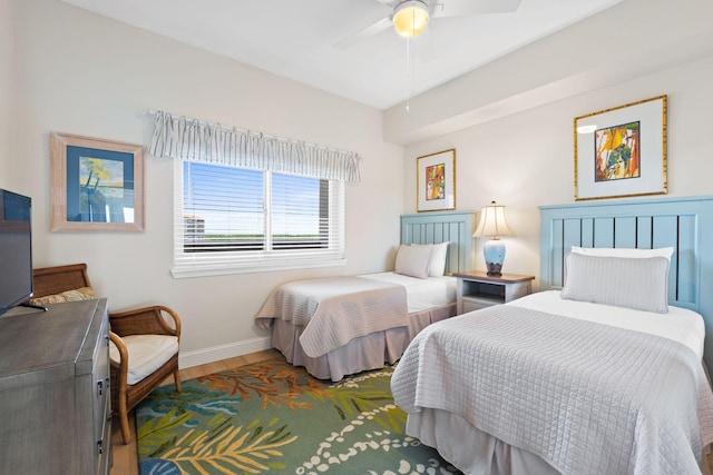 bedroom featuring dark hardwood / wood-style floors and ceiling fan