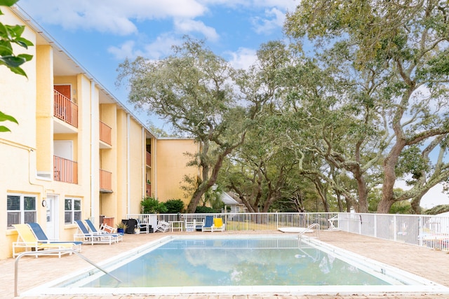 view of pool featuring a patio