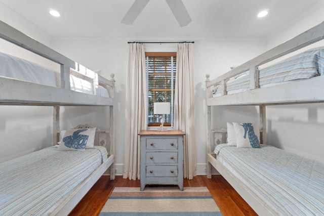 bedroom with ornamental molding, ceiling fan, and dark hardwood / wood-style floors