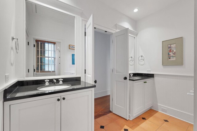 bathroom with tile flooring and vanity