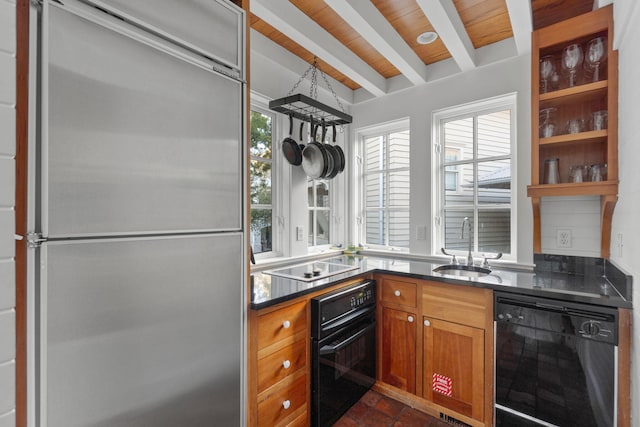 kitchen featuring beamed ceiling, wood ceiling, sink, and black appliances