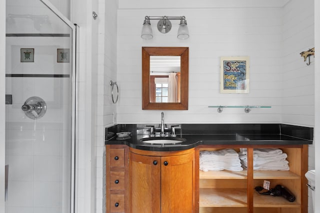 bathroom featuring vanity and an enclosed shower