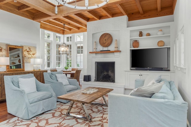 16 S Green Turtle Ln, Inlet Beach, FL 32461 - living area featuring wood ceiling, a brick fireplace, a chandelier, wood finished floors, and beamed ceiling