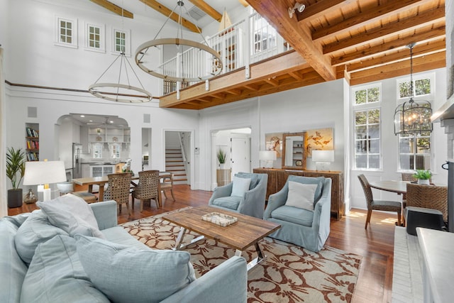 16 S Green Turtle Ln, Inlet Beach, FL 32461 - living room featuring stairway, a chandelier, a high ceiling, and beam ceiling