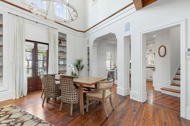 16 S Green Turtle Ln, Inlet Beach, FL 32461 - dining area featuring arched walkways, stairs, wood-type flooring, and built in shelves