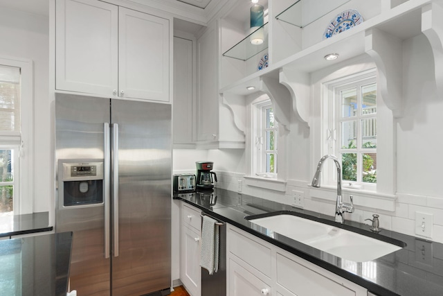 16 S Green Turtle Ln, Inlet Beach, FL 32461 - kitchen with dark countertops, stainless steel appliances, white cabinets, and a sink