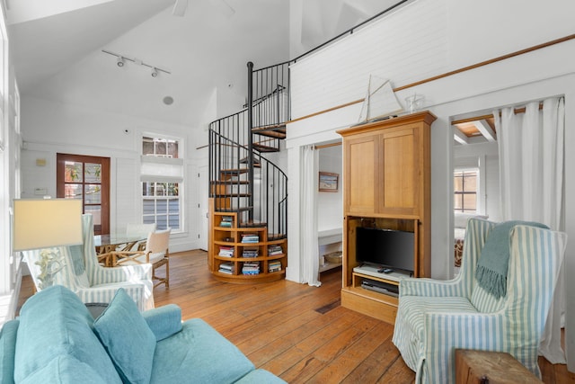 16 S Green Turtle Ln, Inlet Beach, FL 32461 - living area with rail lighting, stairs, light wood-type flooring, and high vaulted ceiling