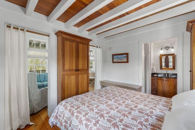 16 S Green Turtle Ln, Inlet Beach, FL 32461 - bedroom featuring wood-type flooring, beam ceiling, a sink, and access to exterior