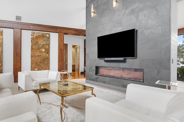 living room with tile walls and light wood-type flooring