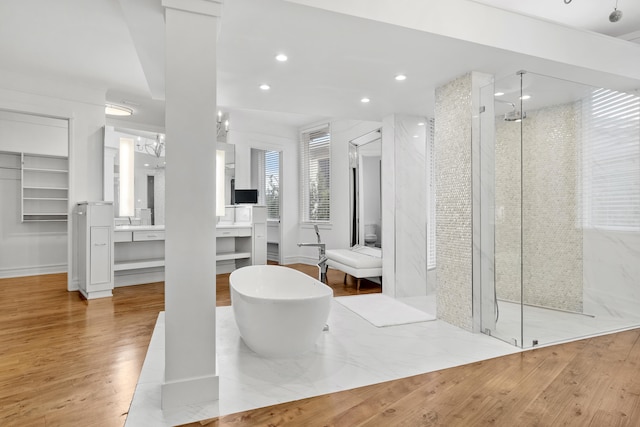 bathroom featuring vanity with extensive cabinet space, an enclosed shower, tile floors, and a notable chandelier